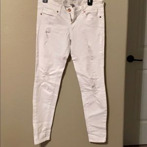 Distressed white jeans